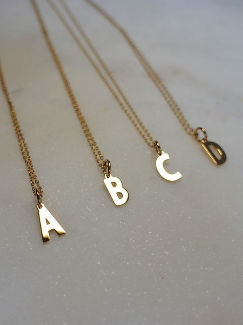 Initial | Collier