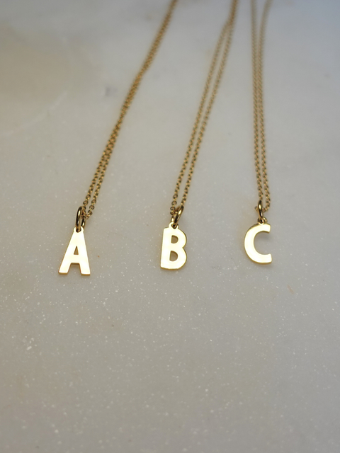 Initial | Collier